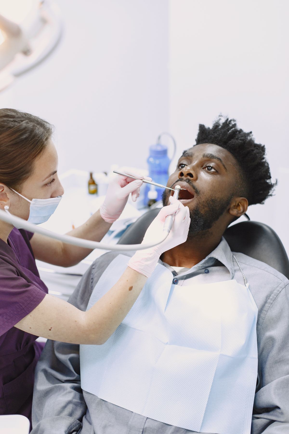 A dentist treating a patient in a modern dental practice